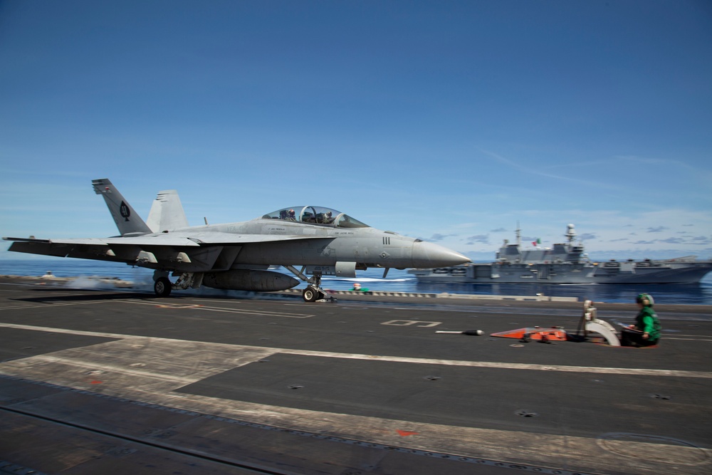 Abraham Lincoln Carrier Strike Group and Cavour Carrier Strike Group Sail in the Pacific Ocean
