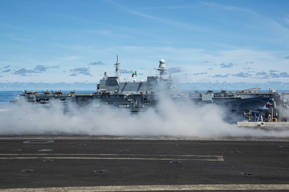 Abraham Lincoln Carrier Strike Group and Cavour Carrier Strike Group Sail in the Pacific Ocean
