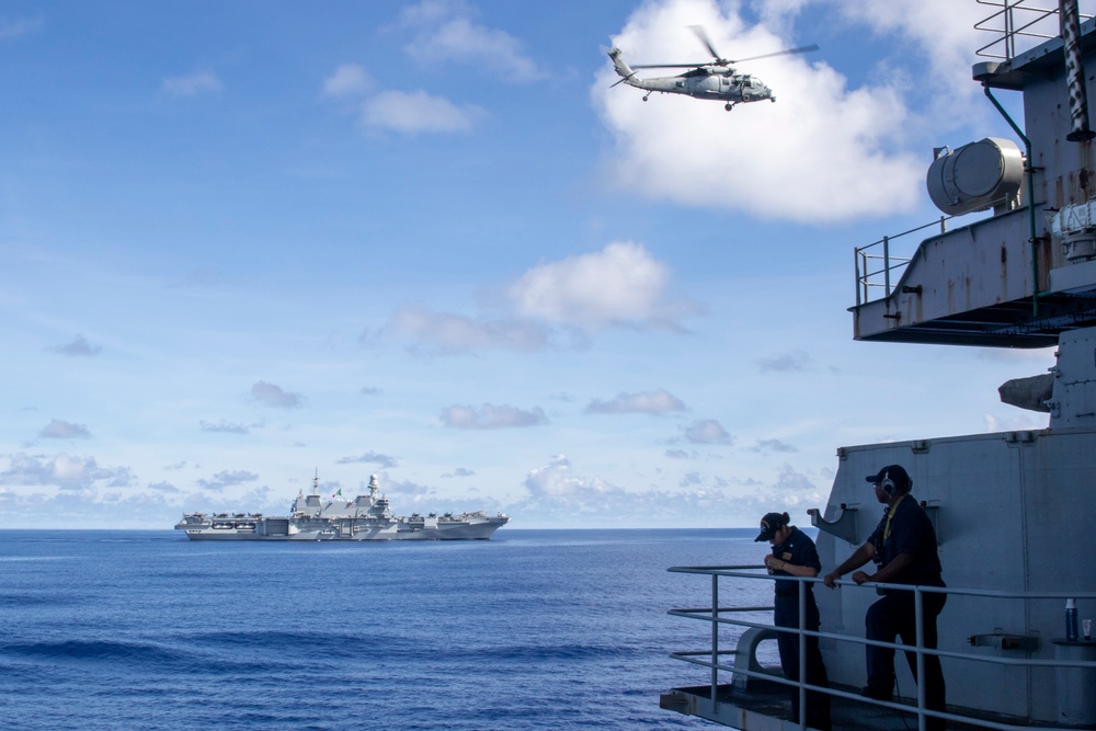 Abraham Lincoln Carrier Strike Group and Cavour Carrier Strike Group sail in the Pacific Ocean