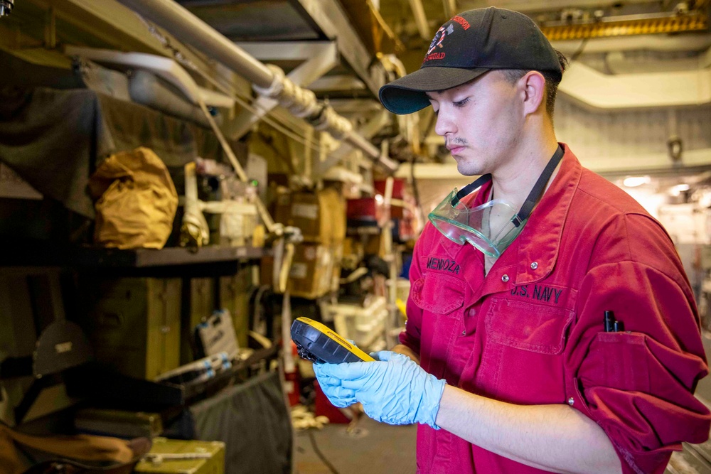 USS Ralph Johnson Sailor Conducts Maintenance