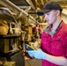 USS Ralph Johnson Sailor Conducts Maintenance