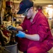 USS Ralph Johnson Sailor Conducts Maintenance