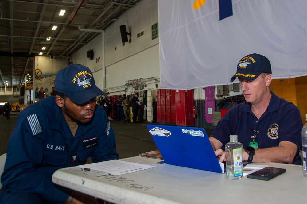 USS Ronald Reagan (CVN 76) Sailors interact with NAVCO