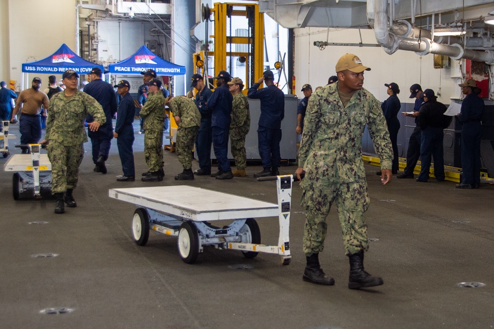 USS Ronald Reagan (CVN 76) Sailors transport sonar buoys