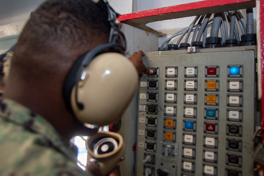 USS Ronald Reagan (CVN 76) Sailors transport sonar buoys