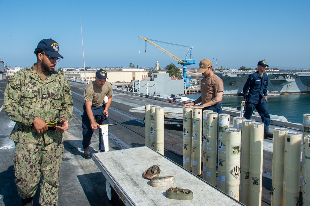 USS Ronald Reagan (CVN 76) Sailors transport sonar buoys