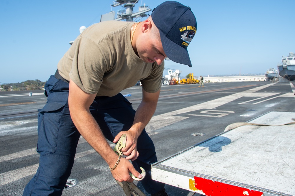USS Ronald Reagan (CVN 76) Sailors transport sonar buoys