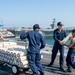 USS Ronald Reagan (CVN 76) Sailors transport sonar buoys