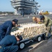 USS Ronald Reagan (CVN 76) Sailors transport sonar buoys