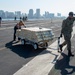 USS Ronald Reagan (CVN 76) Sailors transport sonar buoys