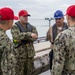 Sailors and Installation Personnel conduct an Oil Spill Simulation Drill