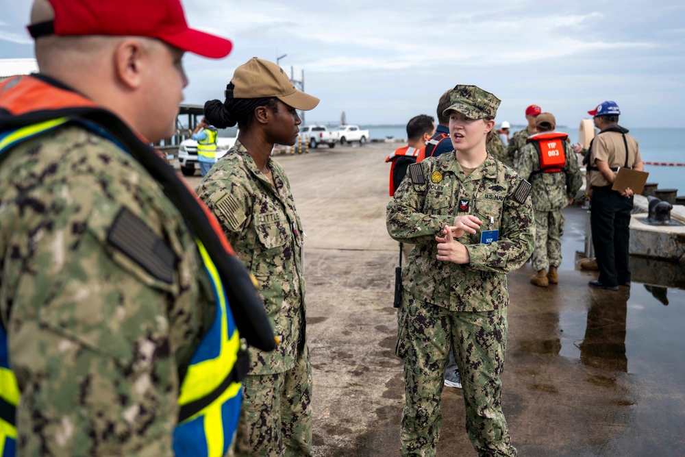 Sailors and Installation Personnel conduct an Oil Spill Simulation Drill