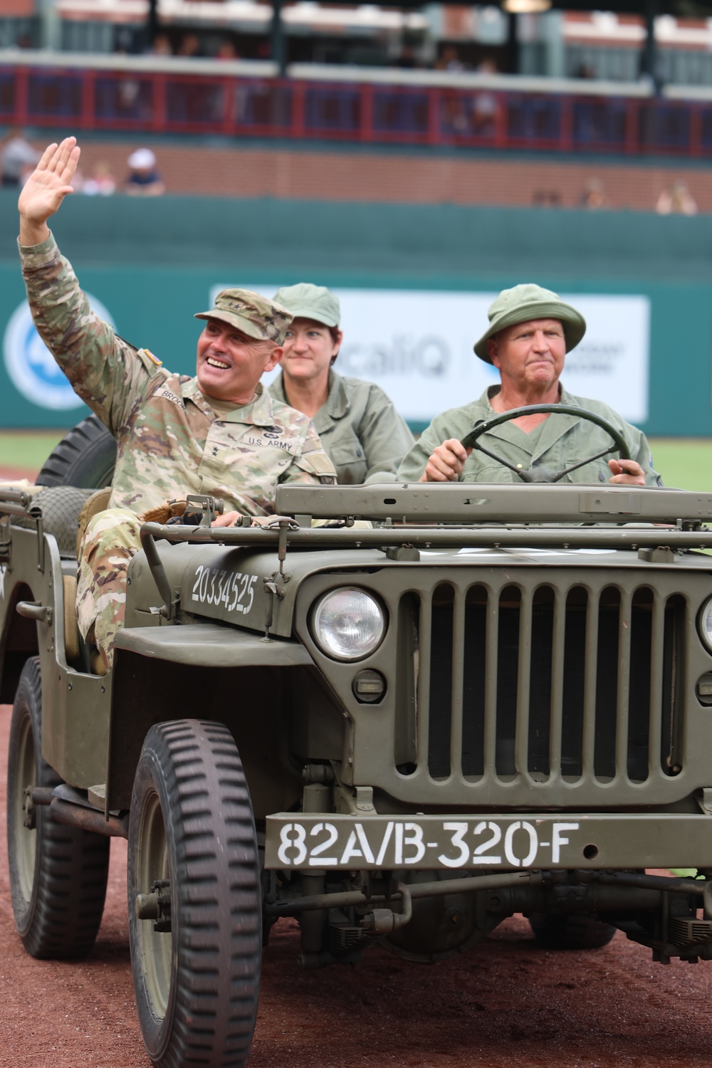 FCOE CG hitches a ride in WWII Jeep at baseball game