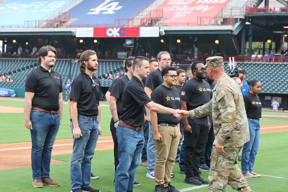 FCOE CG swears in recruits during baseball game