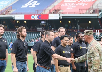 FCOE CG swears in recruits during baseball game