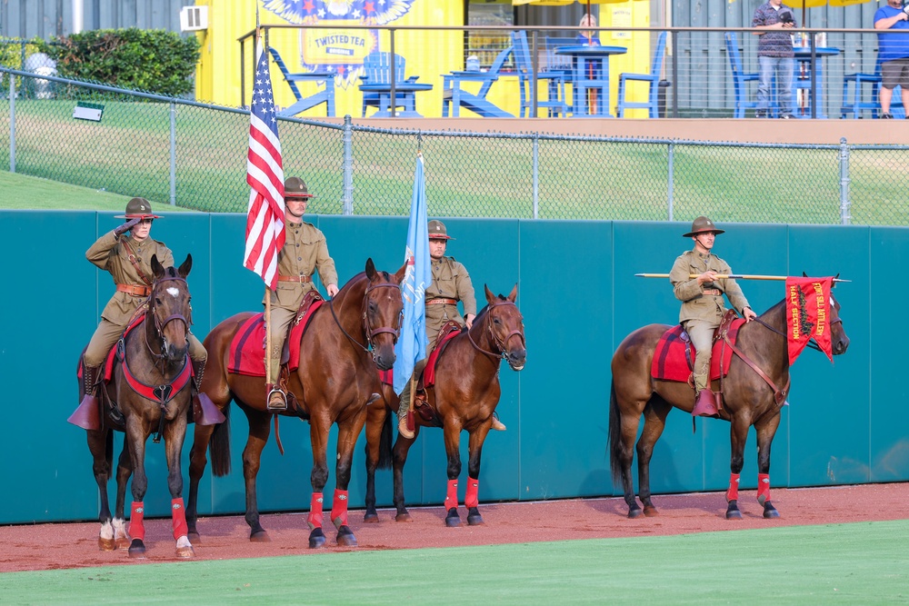 Fort Sill Half Section presents mounted color guard at OKCBC game