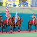 Fort Sill Half Section presents mounted color guard at OKCBC game