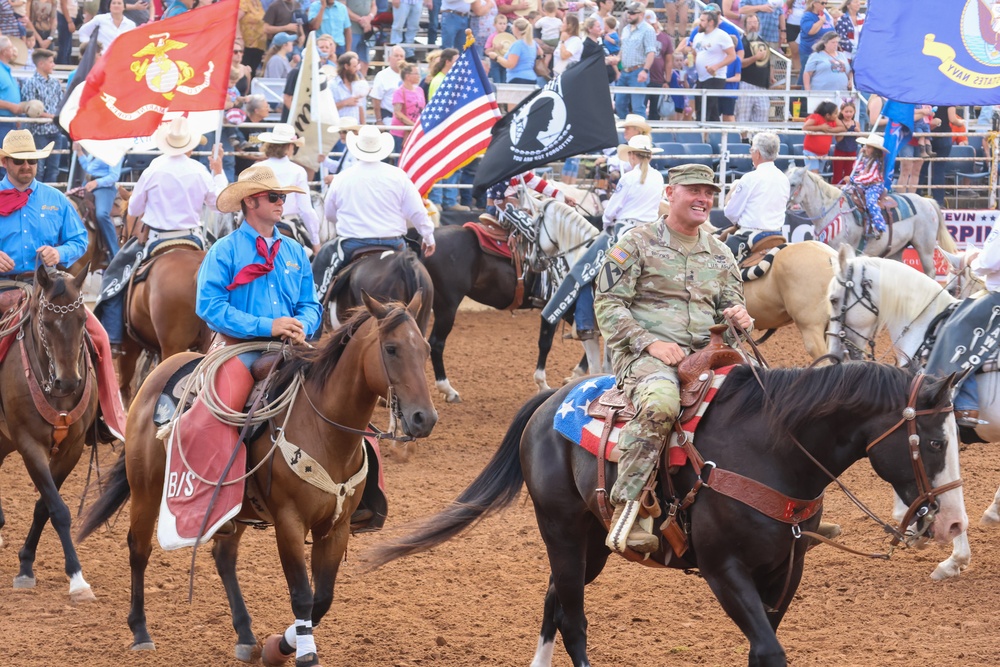 FCOE CG rides in rodeo grand entry