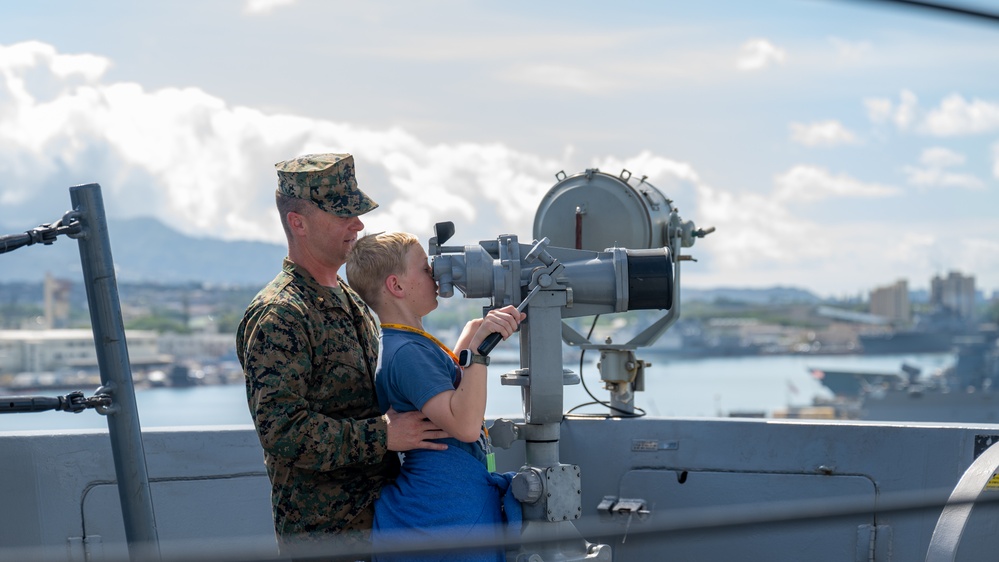 Family members embark USS Somerset for Tiger Cruise