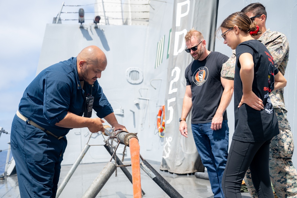 Family members embark USS Somerset for Tiger Cruise