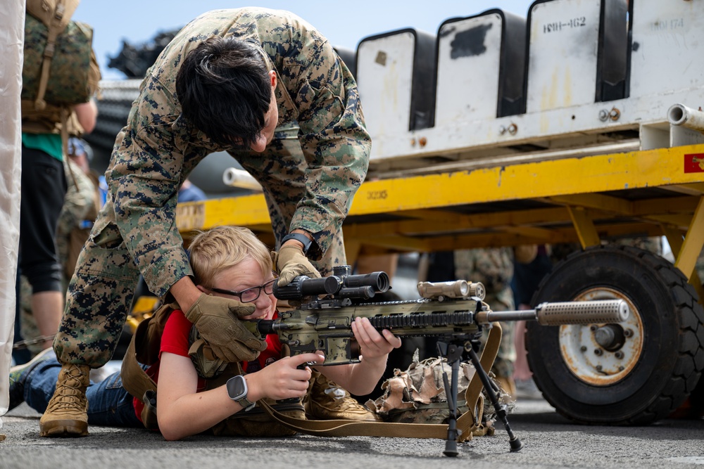 Family members embark USS Somerset for Tiger Cruise