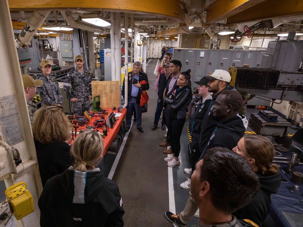 Port Adelaide Football Team members tour submarine tender USS Emory S. Land (AS 39)