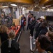 Port Adelaide Football Team members tour submarine tender USS Emory S. Land (AS 39)