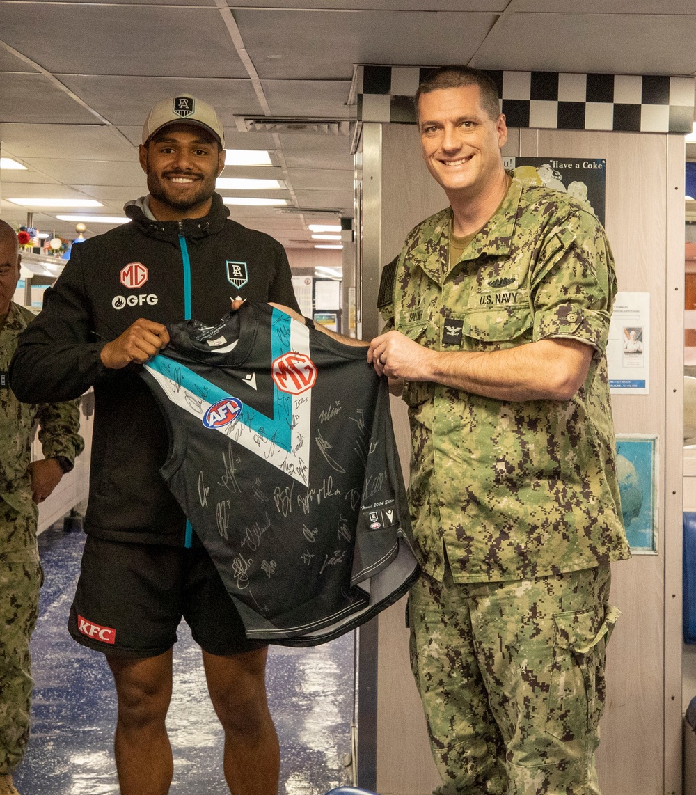 Port Adelaide Football Team members tour submarine tender USS Emory S. Land (AS 39)
