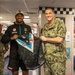 Port Adelaide Football Team members tour submarine tender USS Emory S. Land (AS 39)