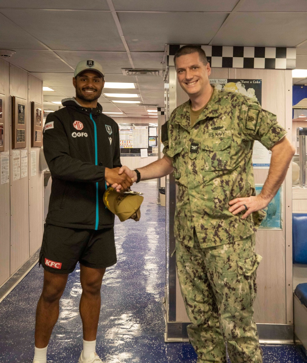 Port Adelaide Football Team members tour submarine tender USS Emory S. Land (AS 39)