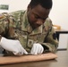 Army medic practices suturing