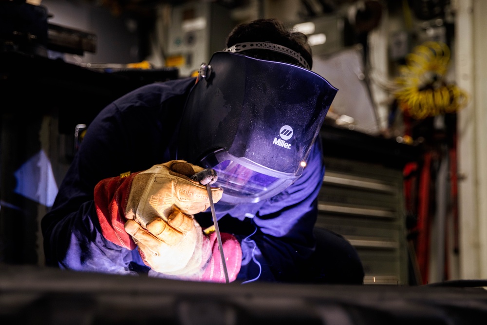 Marine Metal Worker Conducts Maintenance Underway