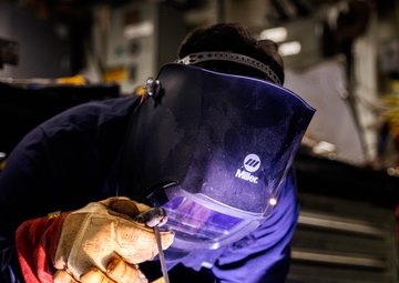 Marine Metal Worker Conducts Maintenance Underway