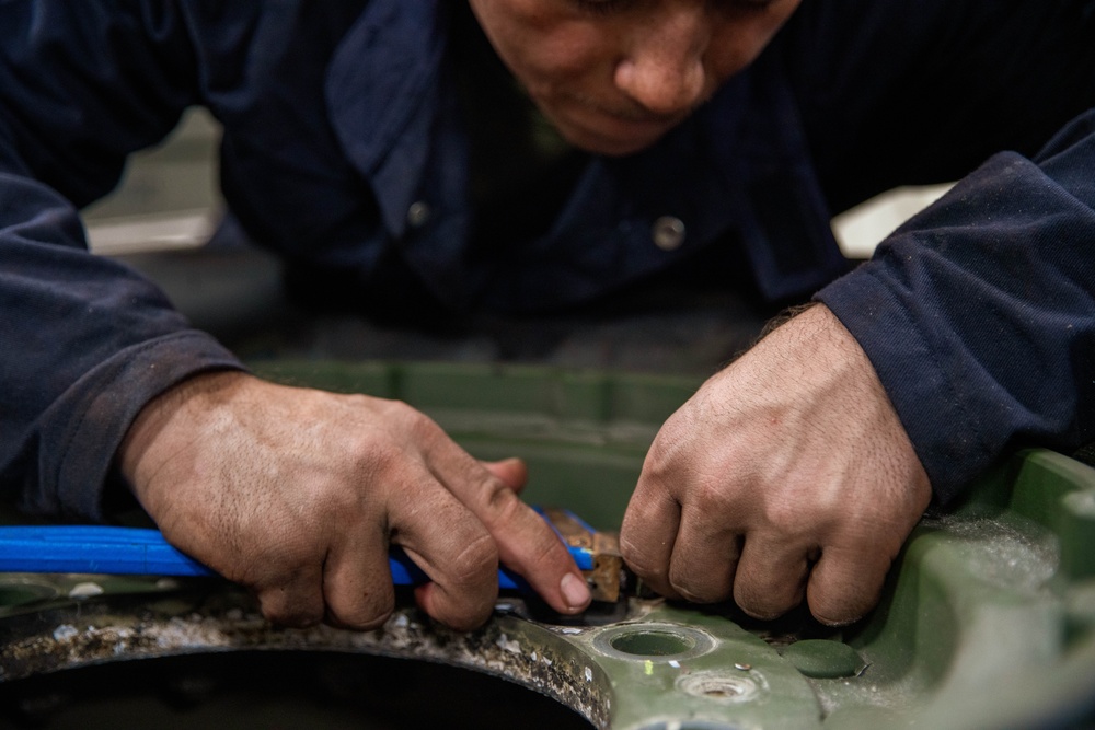 Marine Metal Worker Conducts Maintenance Underway