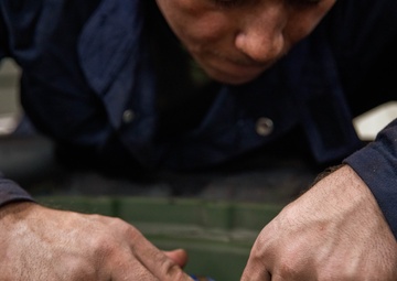 Marine Metal Worker Conducts Maintenance Underway