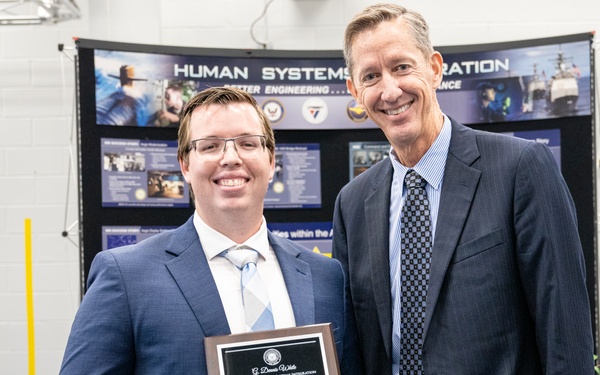 Dr. Brett Seidle, SES, presents G. Dennis White Early Career HSI Practitioner Award