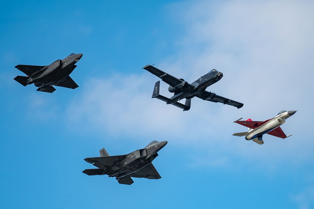 The U.S. Air Force Air Combat Command demonstration teams perform a four-ship heritage flight at EAA AirVenture Oshkosh