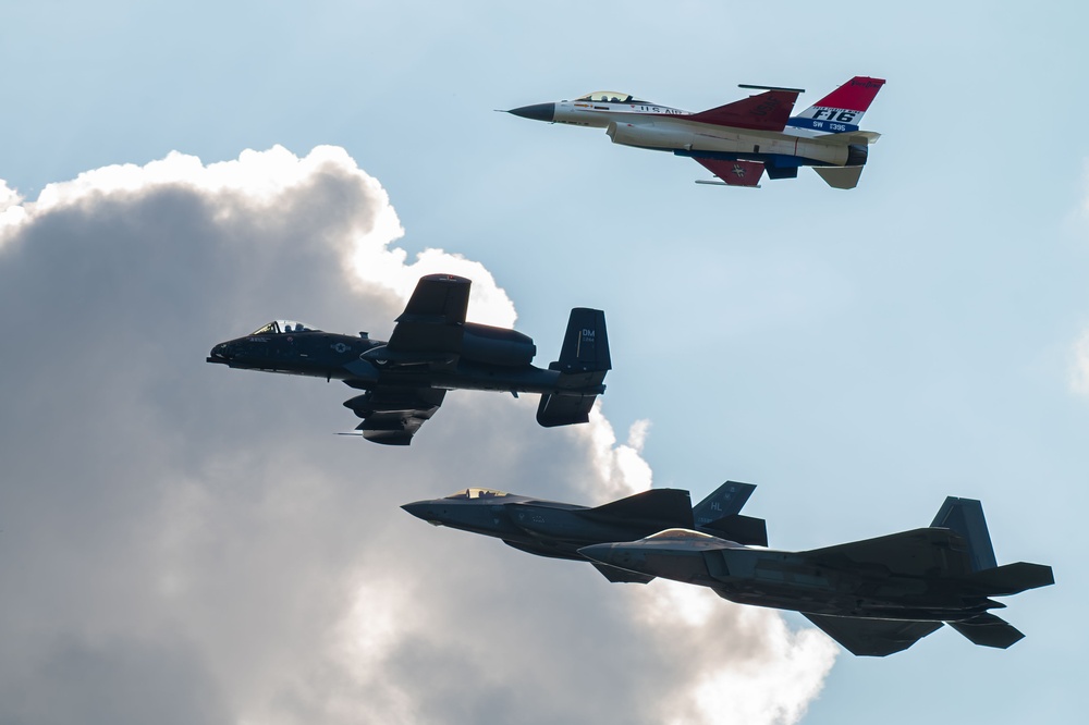 The U.S. Air Force Air Combat Command demonstration teams perform a four-ship heritage flight at EAA AirVenture Oshkosh