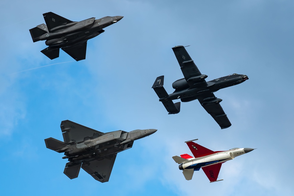 The U.S. Air Force Air Combat Command demonstration teams perform a four-ship heritage flight at EAA AirVenture Oshkosh