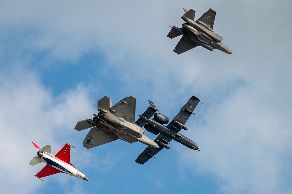 The U.S. Air Force Air Combat Command demonstration teams perform a four-ship heritage flight at EAA AirVenture Oshkosh