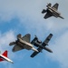 The U.S. Air Force Air Combat Command demonstration teams perform a four-ship heritage flight at EAA AirVenture Oshkosh