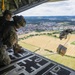 U.S. Army Green Berets perform air drop training with U.S. Air Force Airmen