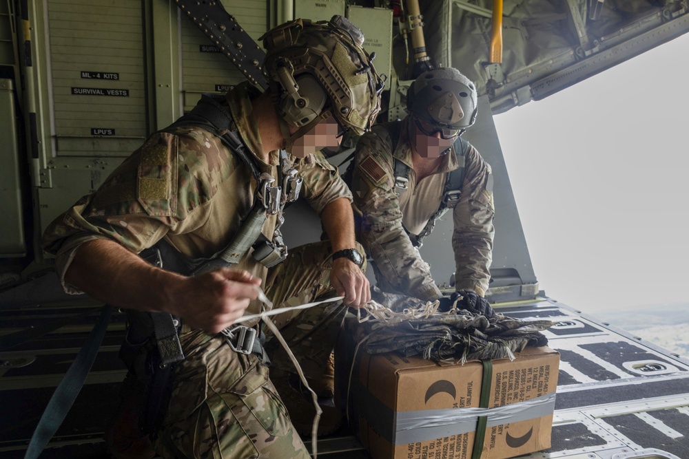 U.S. Army Green Berets perform air drop training with U.S. Air Force Airmen