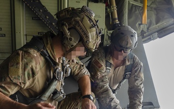 U.S. Army Green Berets perform air drop training with U.S. Air Force Airmen