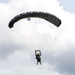 U.S. Army Green Berets perform freefall airborne jump with U.S. Air Force Airmen