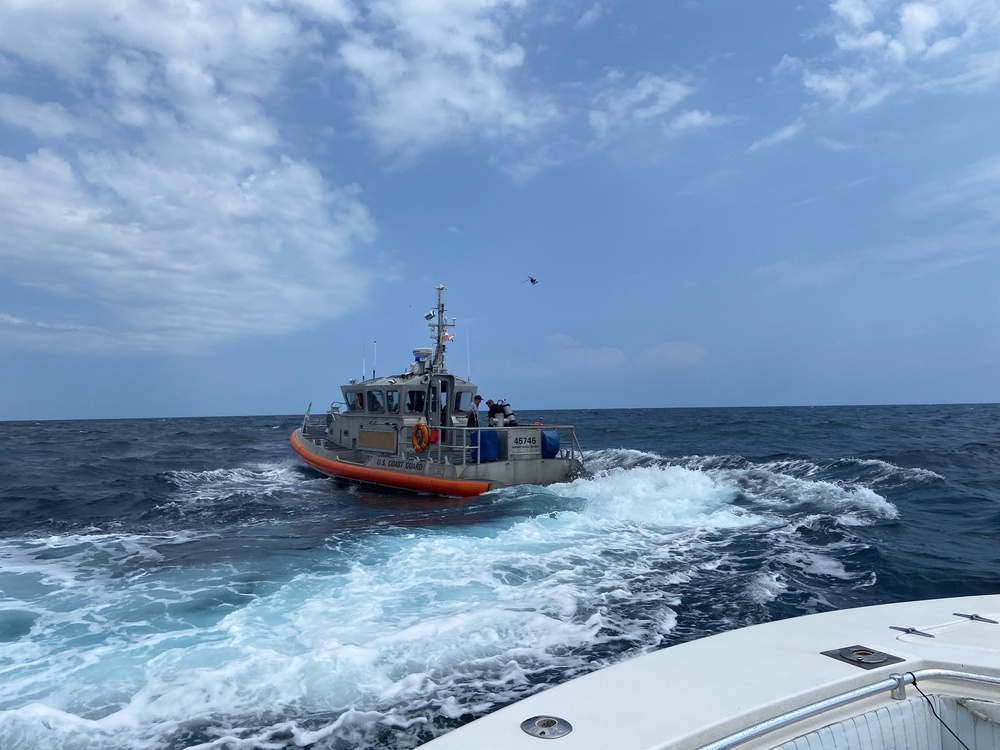 A Coast Guard Station Wrightsville Beach rescue crew and good Samaritans rescued a missing 54-year-old diver 24 miles east of Bald Head Island, North Carolina, on August 13, 2024. Coast Guard Station North Carolina watchstanders received a notification at 12:26 p.m. of an overdue dive master wearing a wetsuit and scuba gear and carrying a personal locator beacon (PLB). (Photo courtesy of Instigator Fishing and Diving Charters)