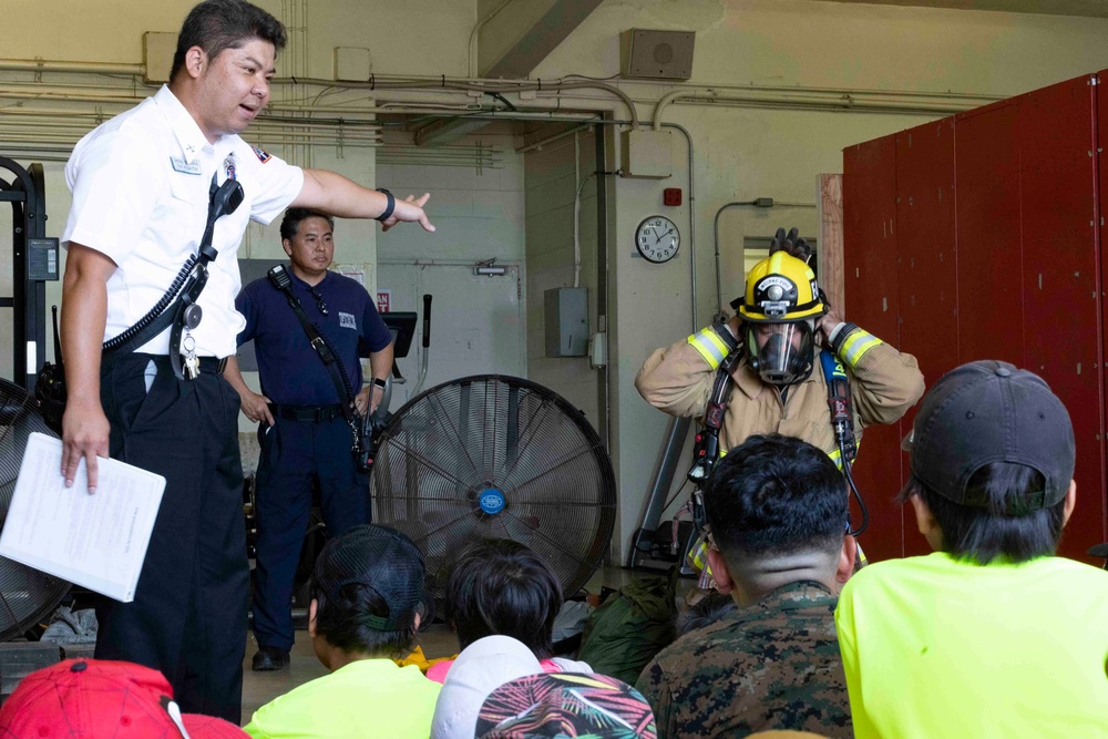 Service members from Camp Schwab host a display for local child-care center