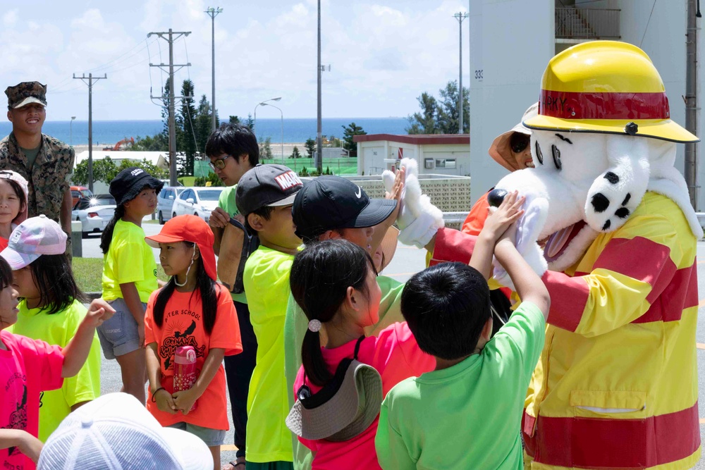 Service members from Camp Schwab host a display for local child-care center