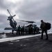 Sailors assigned to (HSC) 4 prepare for flight in an MH-60S Sea Hawk