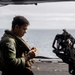 Sailors assigned to (HSC) 4 prepare for flight in an MH-60S Sea Hawk
